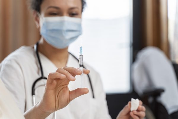doctor-preparing-vaccine-senior-woman doctor-preparing-vaccine-senior-woman