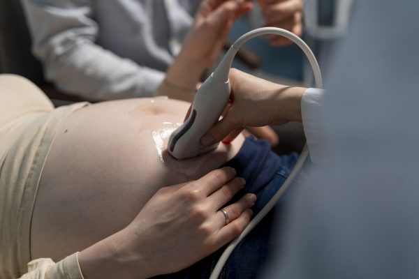 gynecologist-performing-ultrasound-consultation (1) gynecologist-performing-ultrasound-consultation (1)